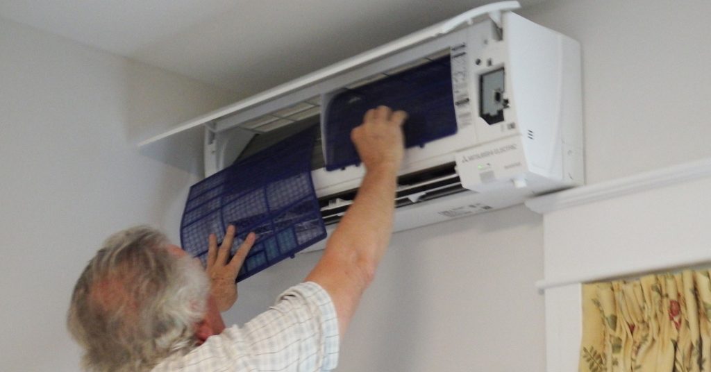 Man Fixing HVAC Unit